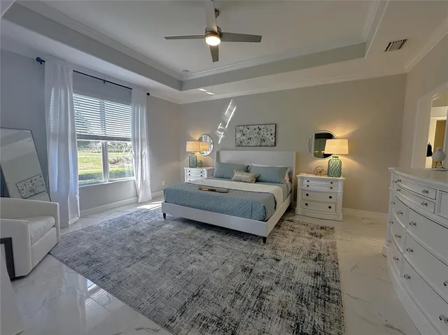 a bedroom with double bed and a window