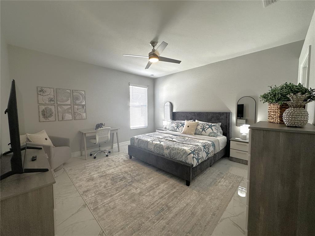 25191 Keygrass Court Punta Gorda, FL 33955 - Photo 23 of 66 a bedroom with a bed a couch and potted plant