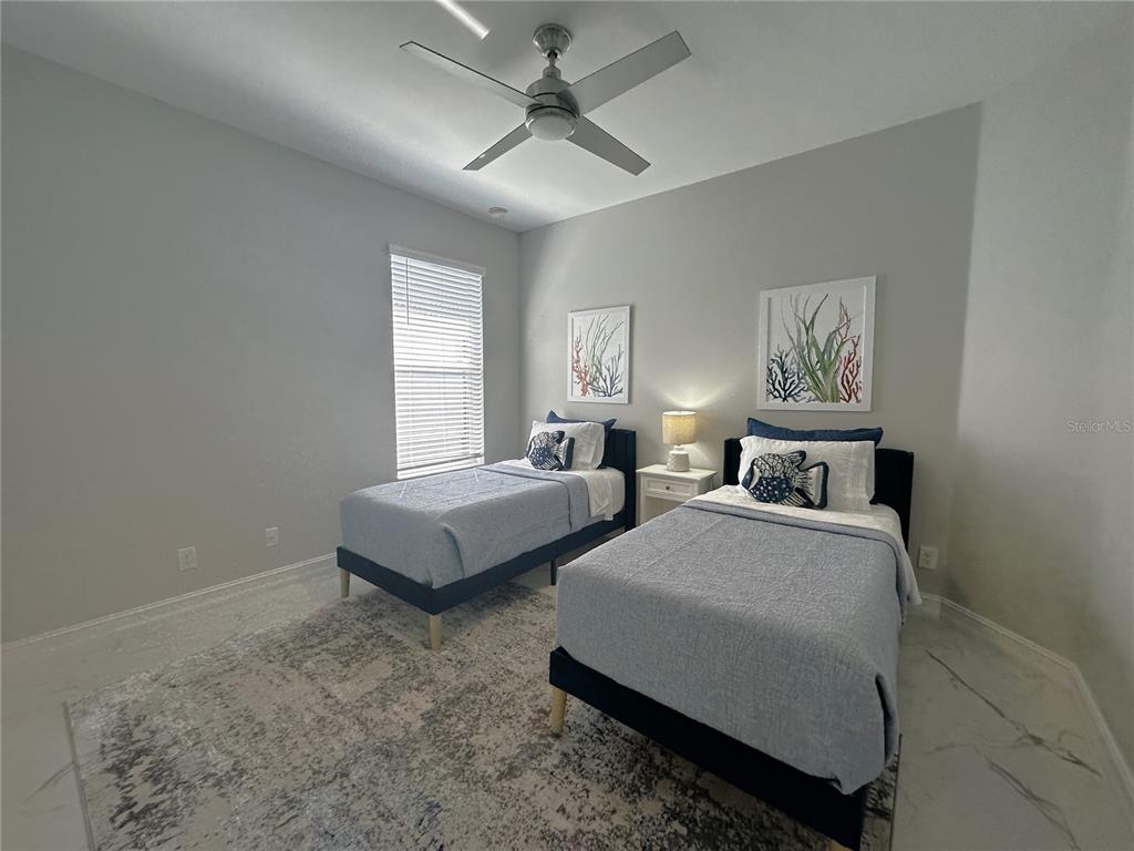 25191 Keygrass Court Punta Gorda, FL 33955 - Photo 26 of 66 a bedroom with double bed and a window