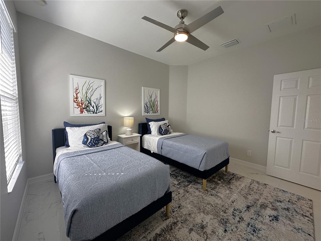 25191 Keygrass Court Punta Gorda, FL 33955 - Photo 27 of 66 a bedroom with double bed and a window