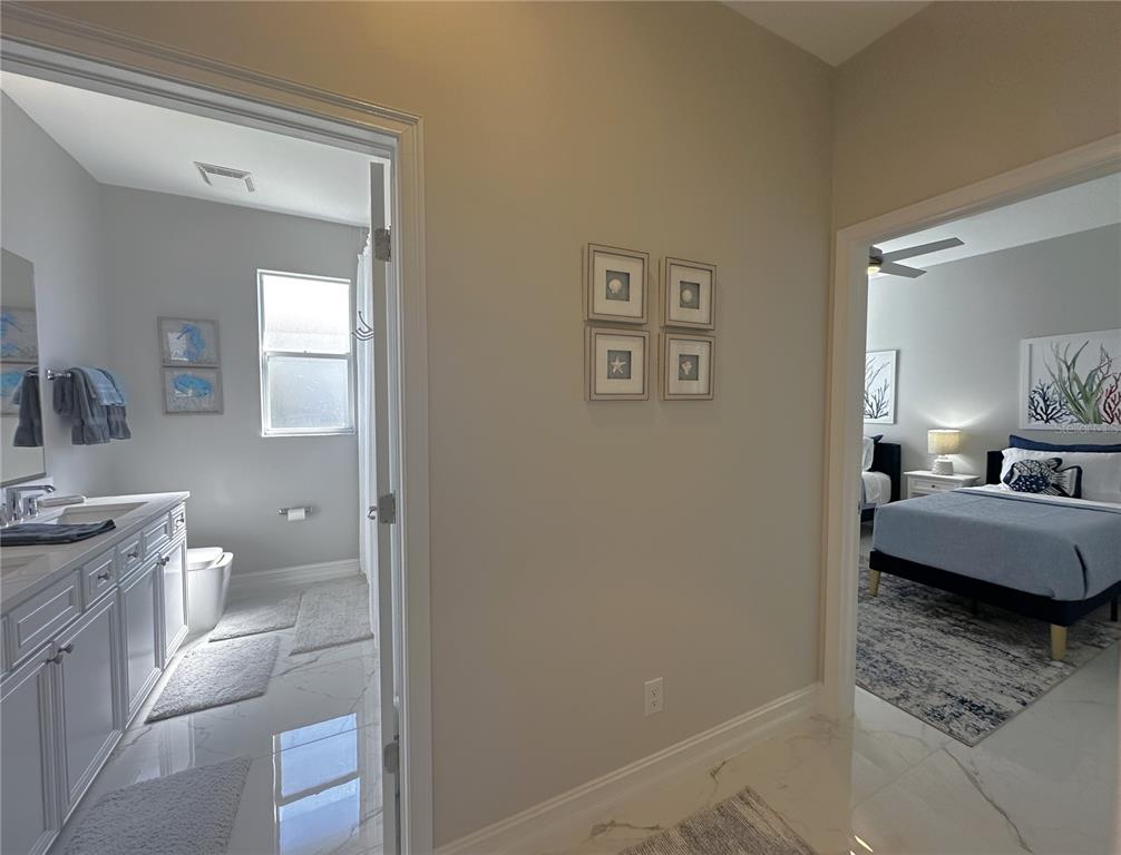 25191 Keygrass Court Punta Gorda, FL 33955 - Photo 28 of 66 a bathroom with a granite countertop sink and a mirror