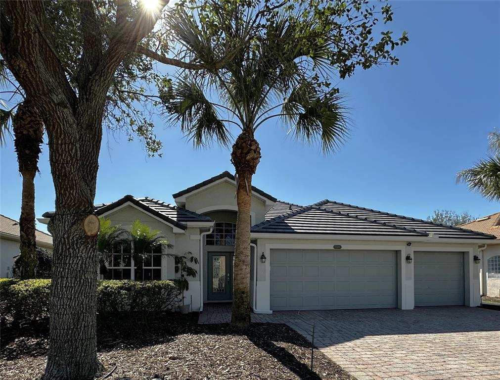 25191 Keygrass Court Punta Gorda, FL 33955 - Photo 37 of 66 a front view of a house with garden