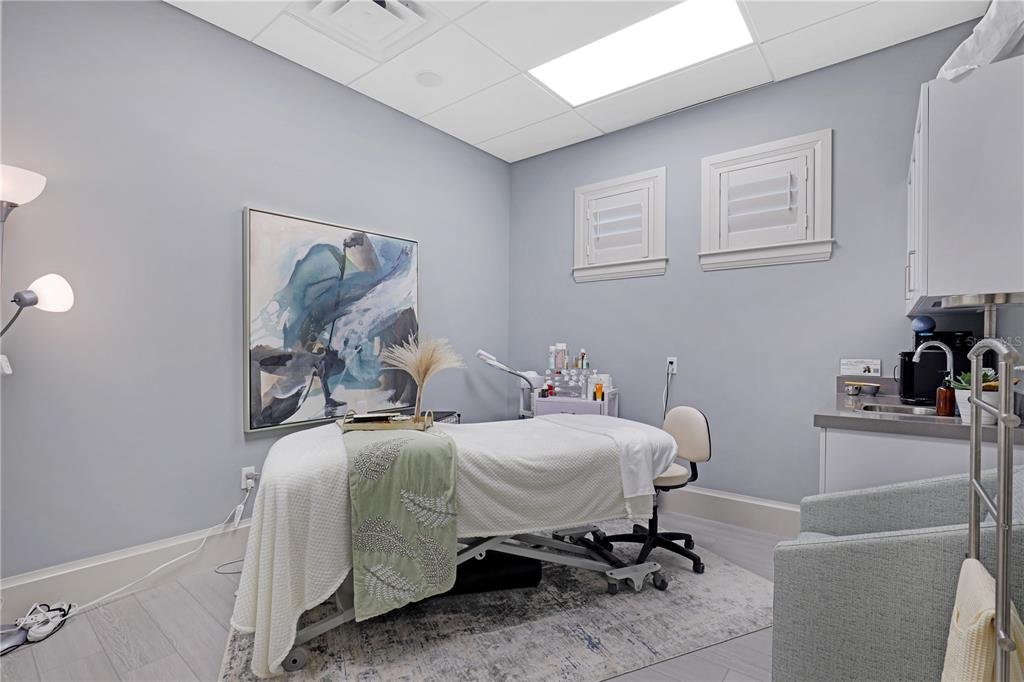 25191 Keygrass Court Punta Gorda, FL 33955 - Photo 40 of 66 a bedroom with a bed and a table