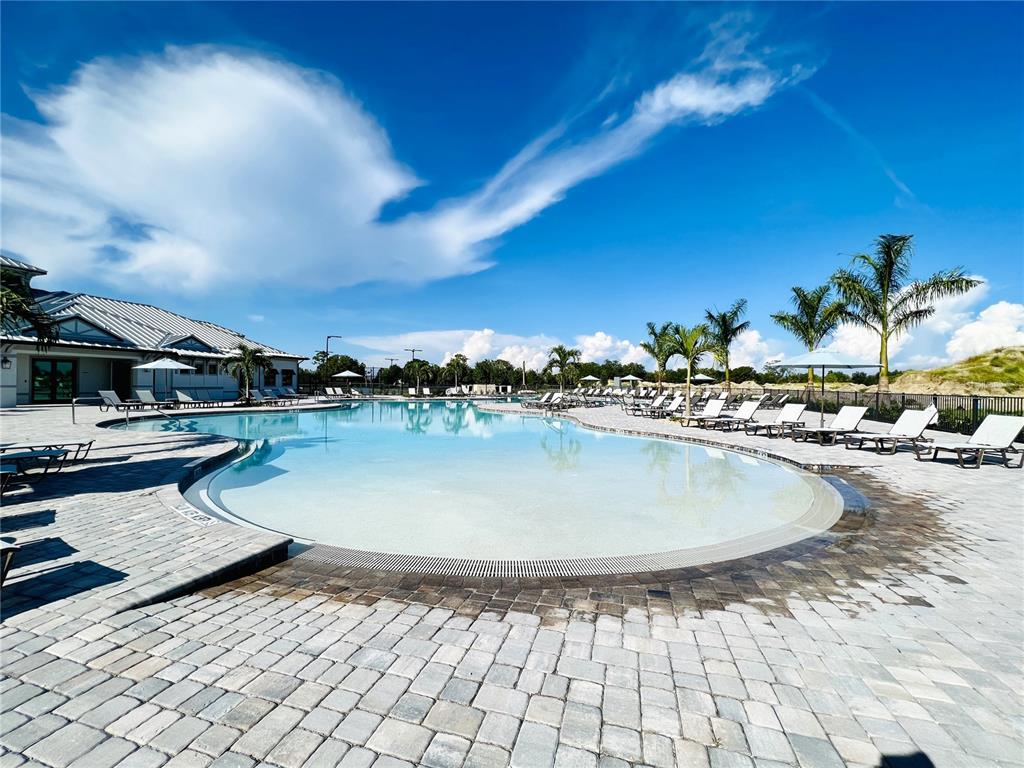 25191 Keygrass Court Punta Gorda, FL 33955 - Photo 49 of 66 a view of swimming pool with outdoor seating and plants