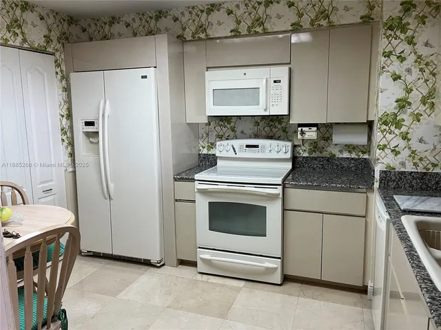 a living room with furniture a rug and a window