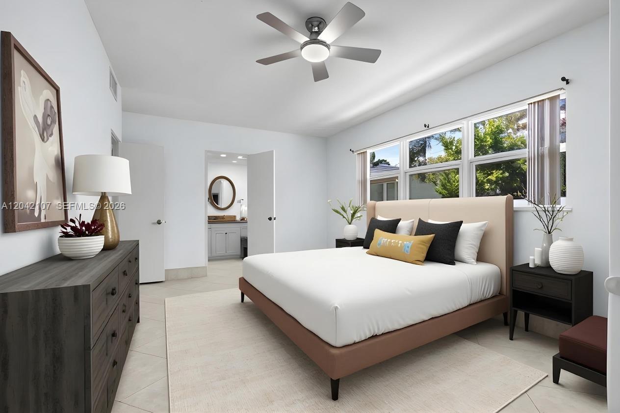 3213 Colony Club Road, Unit 3E Pompano Beach, FL 33062 - Photo 30 of 31 a bedroom with a bed and a table