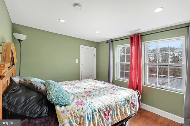 a utility room with lot of furniture and a chandelier