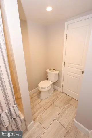 a bed sitting in a room next to a window