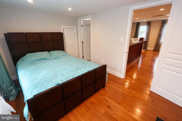 a room with a bed and a flat screen tv