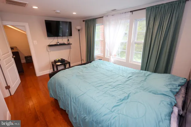 a bedroom with a bed and cabinets