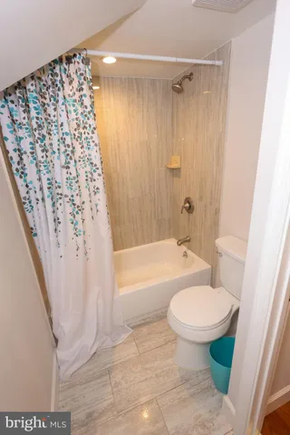 a view of hallway with wooden floor