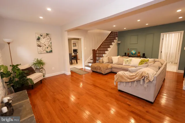 a view of a livingroom with furniture and wooden floor