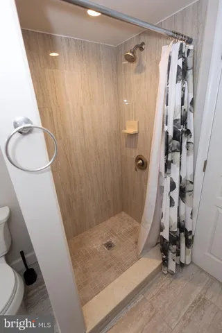 a bedroom with a bed and a lamp