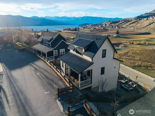 an aerial view of a house with a mountain view