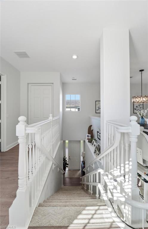 7842 Hawthorne Drive, Unit 1703 Naples, FL 34113 - Photo 13 of 31 a view of entryway and hall with wooden floor