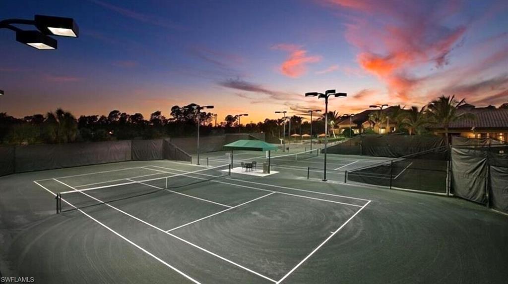 7842 Hawthorne Drive, Unit 1703 Naples, FL 34113 - Photo 29 of 31 a view of a tennis court