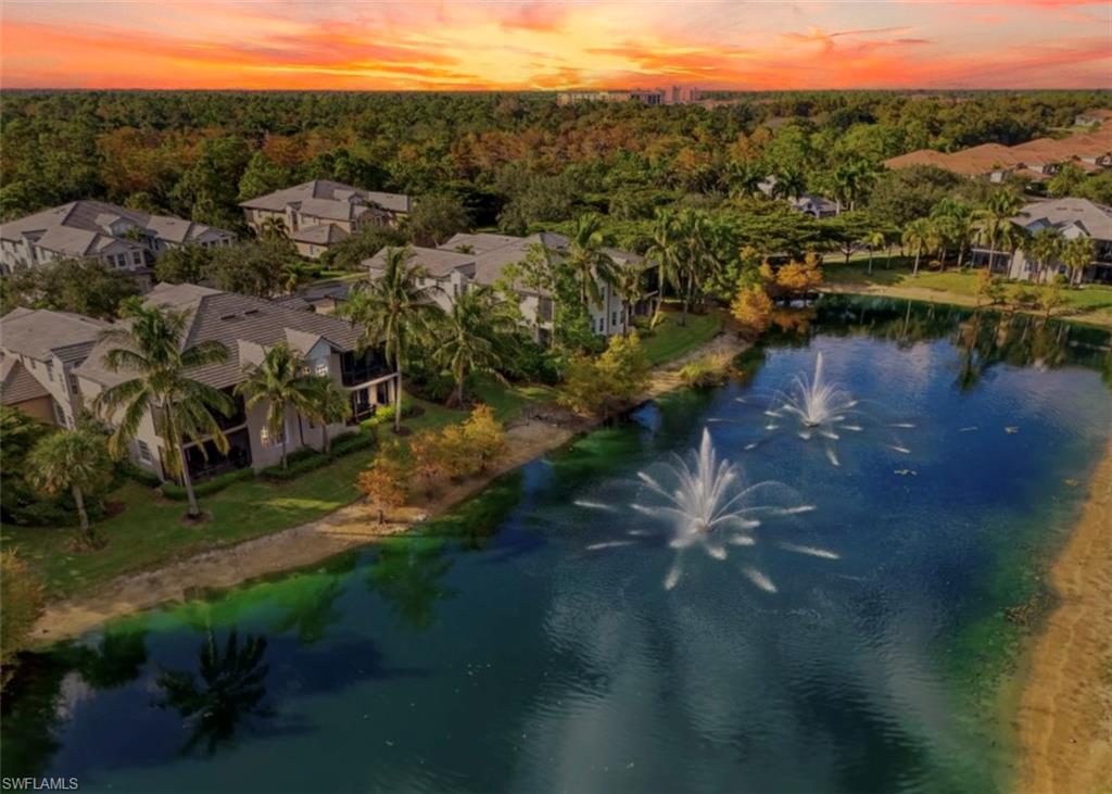 7842 Hawthorne Drive, Unit 1703 Naples, FL 34113 - Photo 8 of 31 a view of a lake with lots of residential buildings