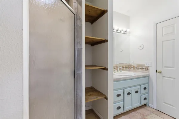 a view of an entryway with cabinet