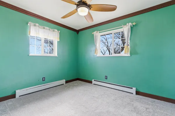 a view of room with window and fan
