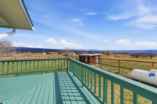 a view of a house with wooden deck