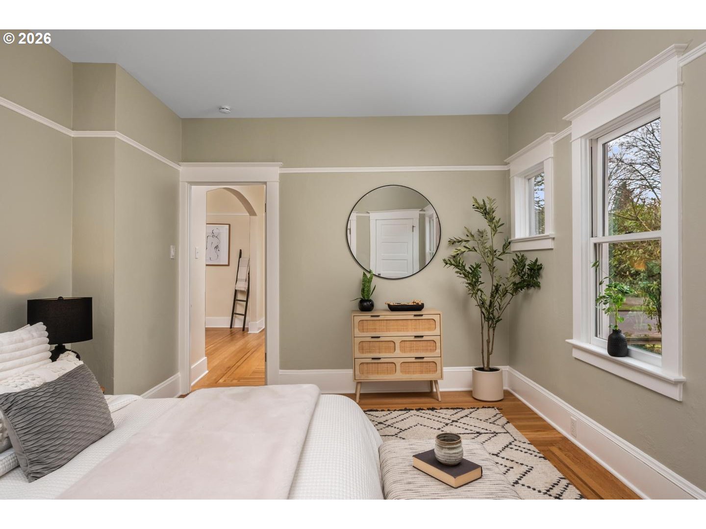 1239 Northeast Sumner Street Portland, OR 97211 - Photo 19 of 48 a bedroom with a bed mirror and window