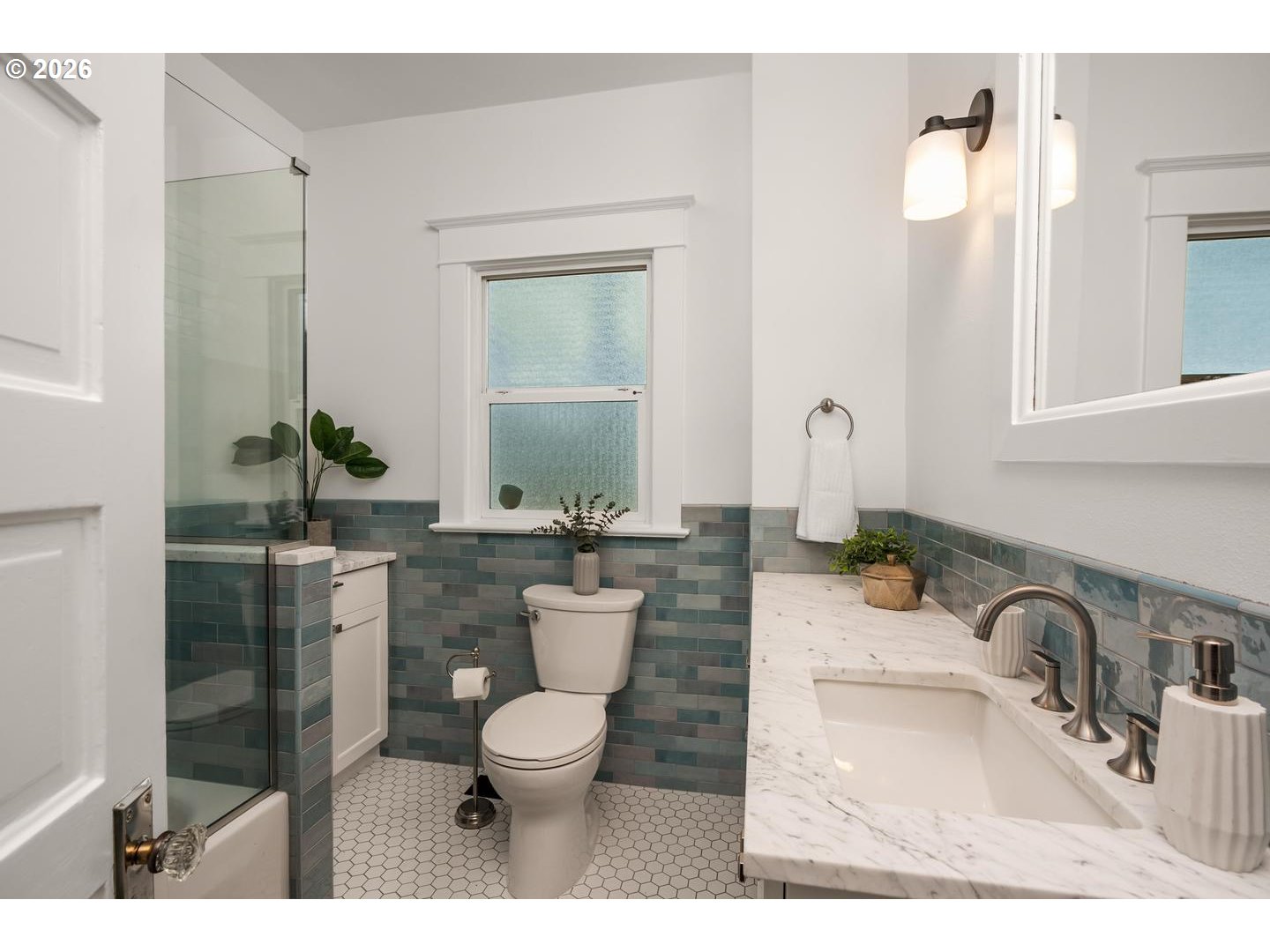 1239 Northeast Sumner Street Portland, OR 97211 - Photo 21 of 48 a bathroom with a toilet a sink and mirror