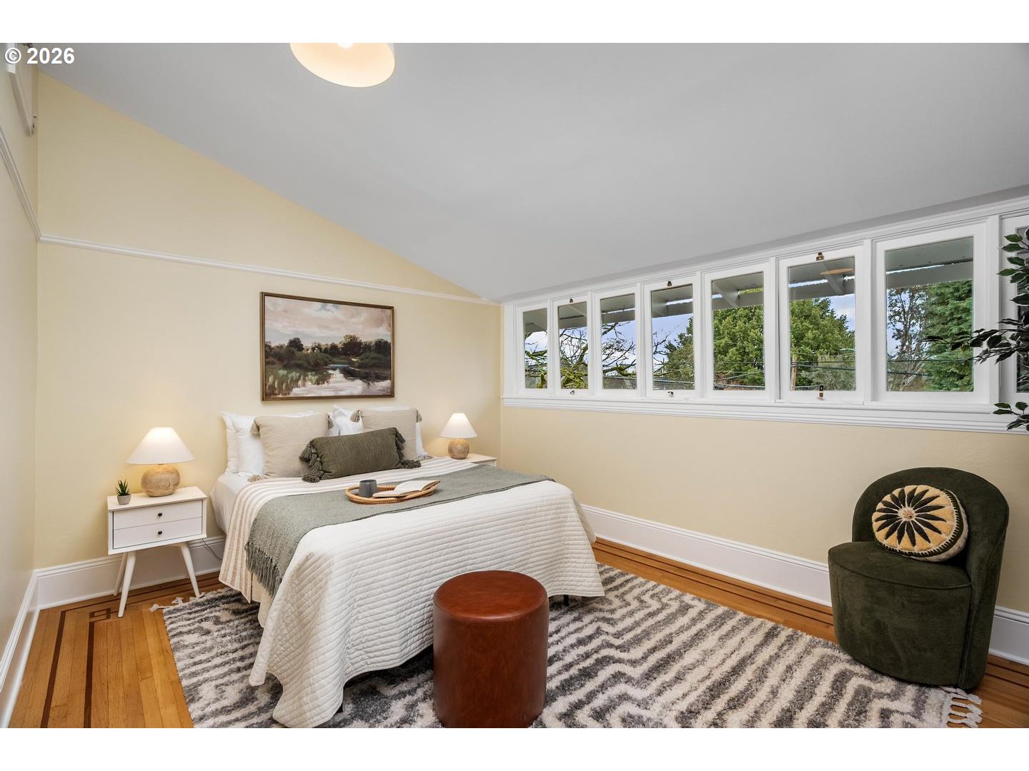 1239 Northeast Sumner Street Portland, OR 97211 - Photo 32 of 48 a bedroom with a bed and a lamp on table