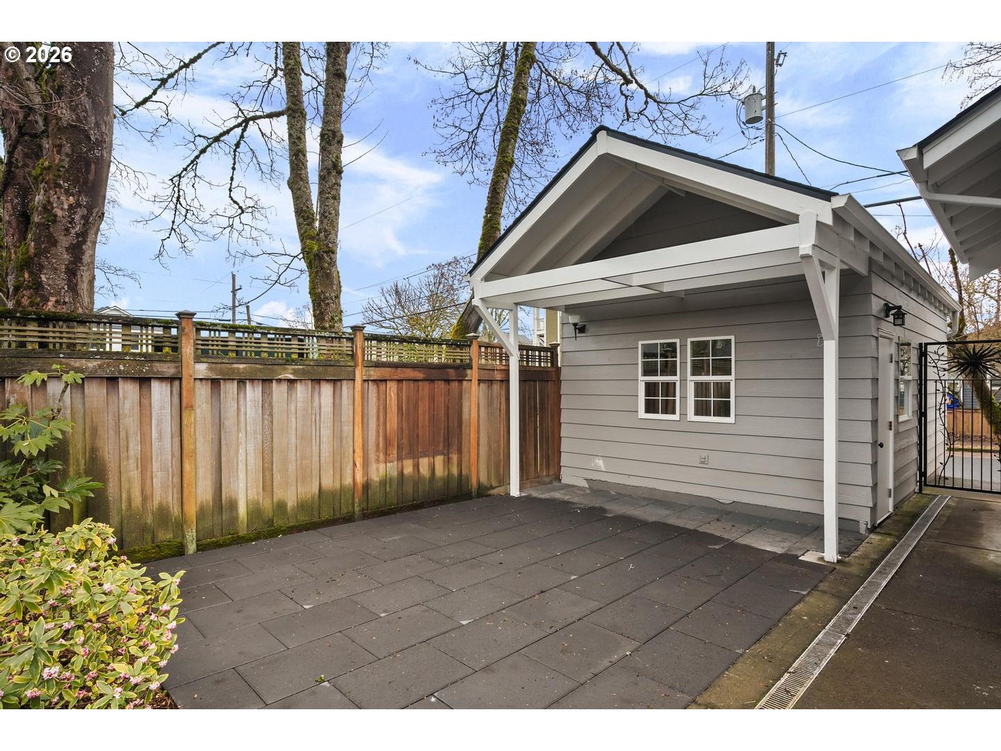 1239 Northeast Sumner Street Portland, OR 97211 - Photo 43 of 48 a view of a house with a wooden fence
