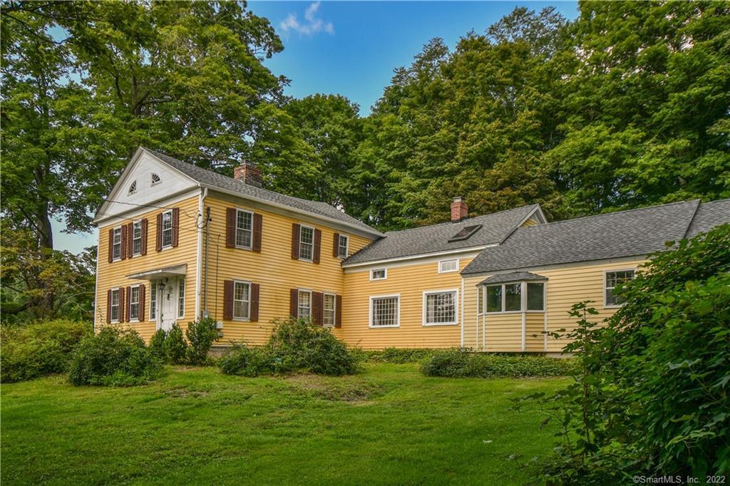 8 Southbury Road Roxbury, CT 06783 - Photo 1 of 1 a front view of a house with a garden