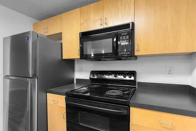 a kitchen with a stove and a microwave