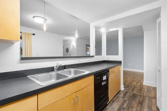 a kitchen with a sink and cabinets