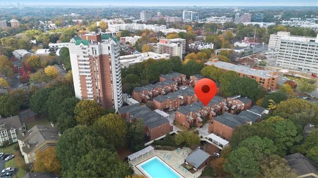 an aerial view of residential houses with outdoor space