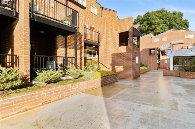 a view of a brick building with many windows