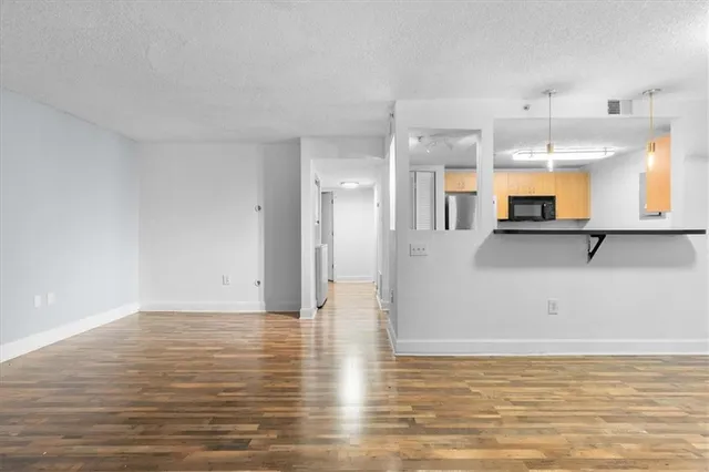 a view of a kitchen with a sink and cabinets