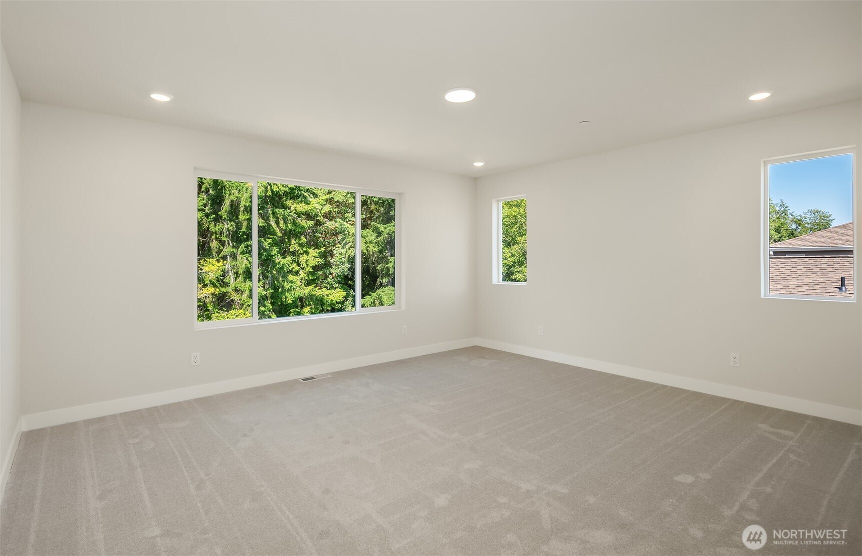 23361 Arbors Terrace Road Northeast, Unit 21 Kingston, WA 98346 - Photo 12 of 19 an empty room with windows