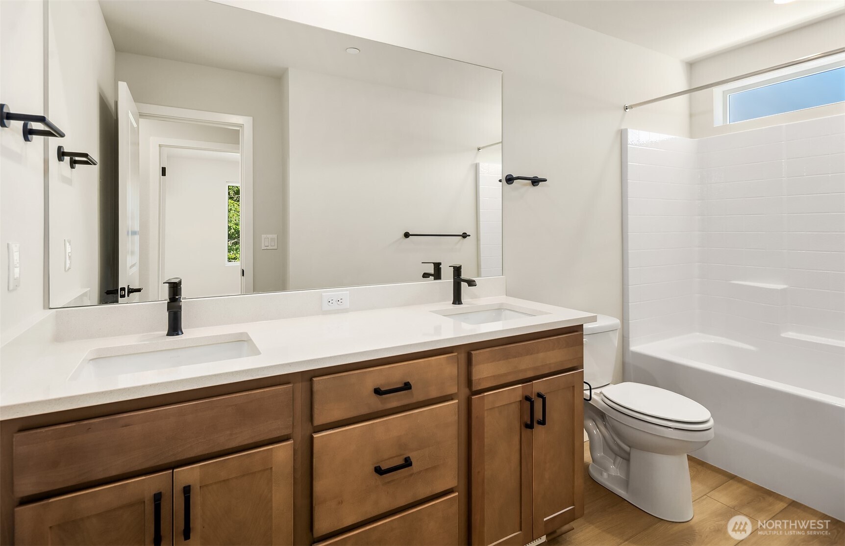 23361 Arbors Terrace Road Northeast, Unit 21 Kingston, WA 98346 - Photo 14 of 19 a bathroom with a sink a toilet and shower
