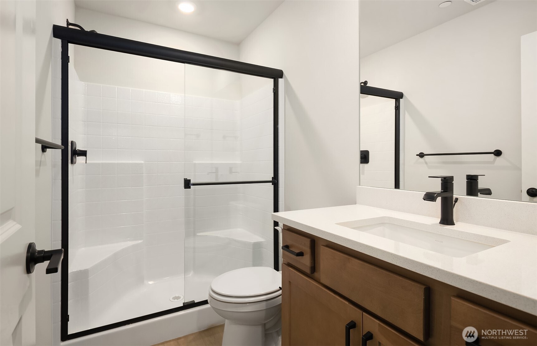 23361 Arbors Terrace Road Northeast, Unit 21 Kingston, WA 98346 - Photo 16 of 19 a bathroom with a sink toilet and shower