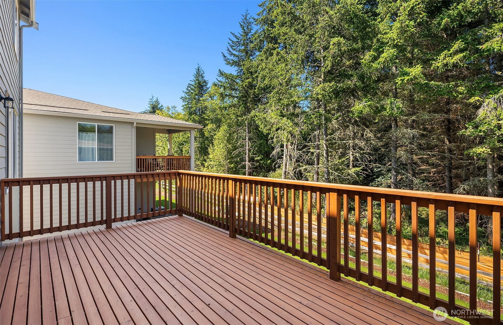 23361 Arbors Terrace Road Northeast, Unit 21 Kingston, WA 98346 - Photo 7 of 19 a view of a wooden roof deck