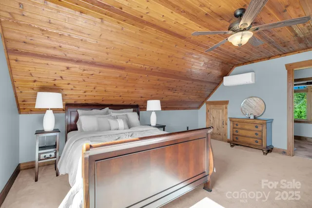a bathroom with a granite countertop sink and a large mirror
