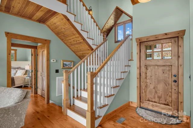 a view of an empty room with window a ceiling fan
