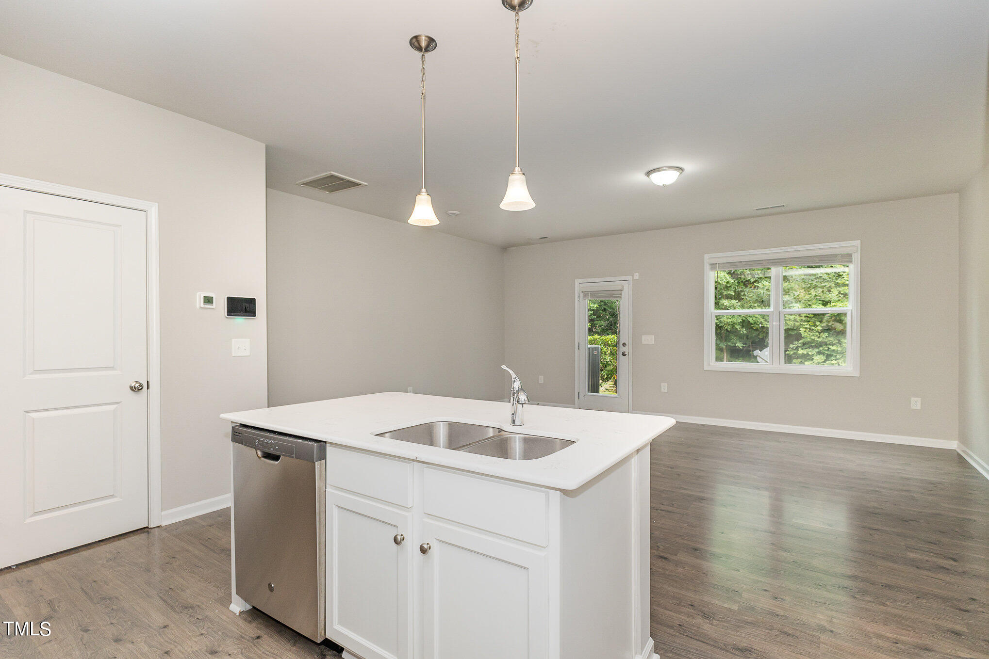 3607 Water Mist Lane Raleigh, NC 27604 - Photo 12 of 30 a kitchen with a sink and dishwasher with wooden floor