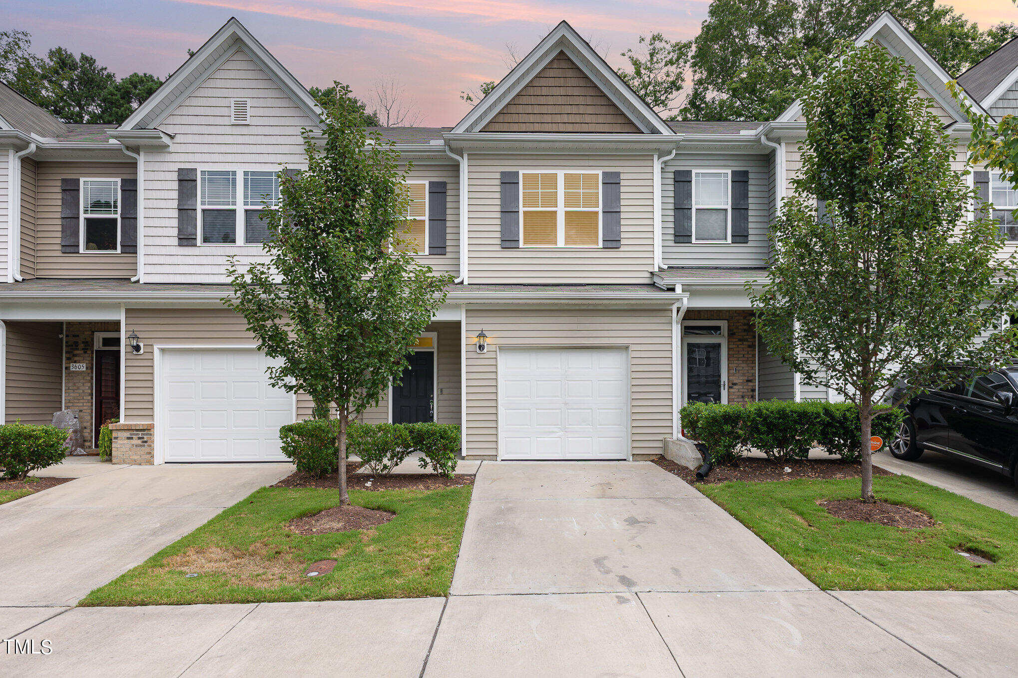 3607 Water Mist Lane Raleigh, NC 27604 - Photo 2 of 30 a front view of a house with a yard and potted plants