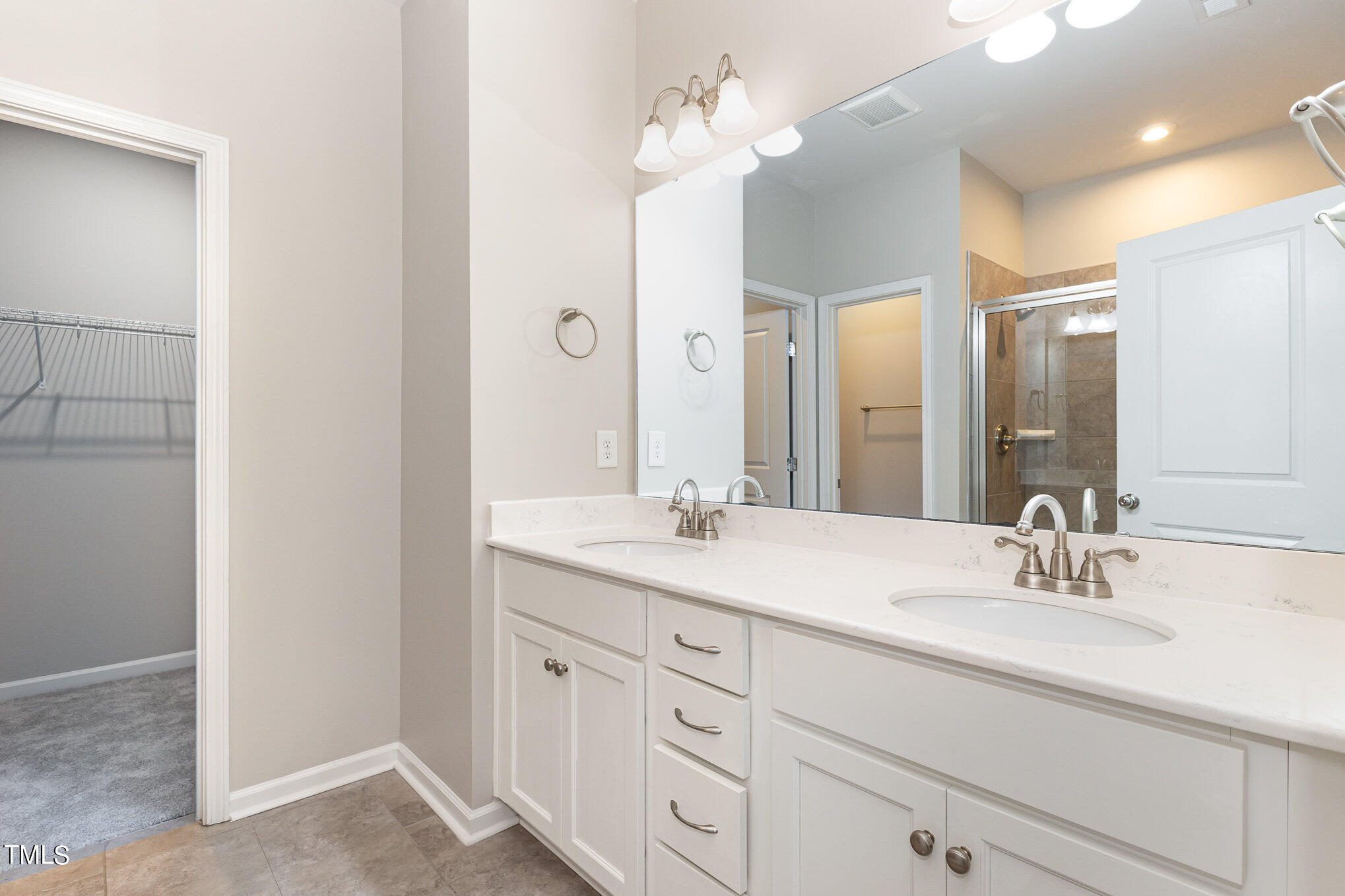 3607 Water Mist Lane Raleigh, NC 27604 - Photo 21 of 30 a bathroom with a sink vanity and mirror