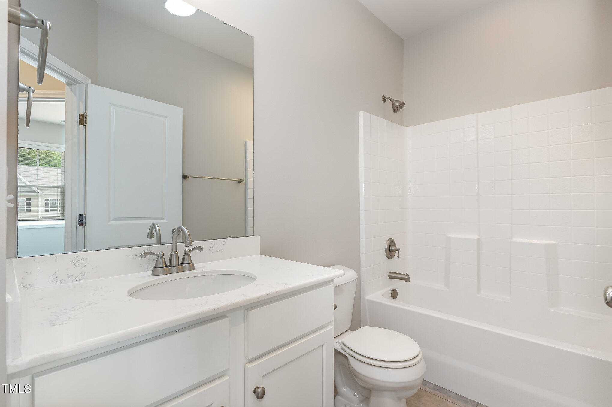 3607 Water Mist Lane Raleigh, NC 27604 - Photo 25 of 30 a bathroom with a sink toilet vanity and shower