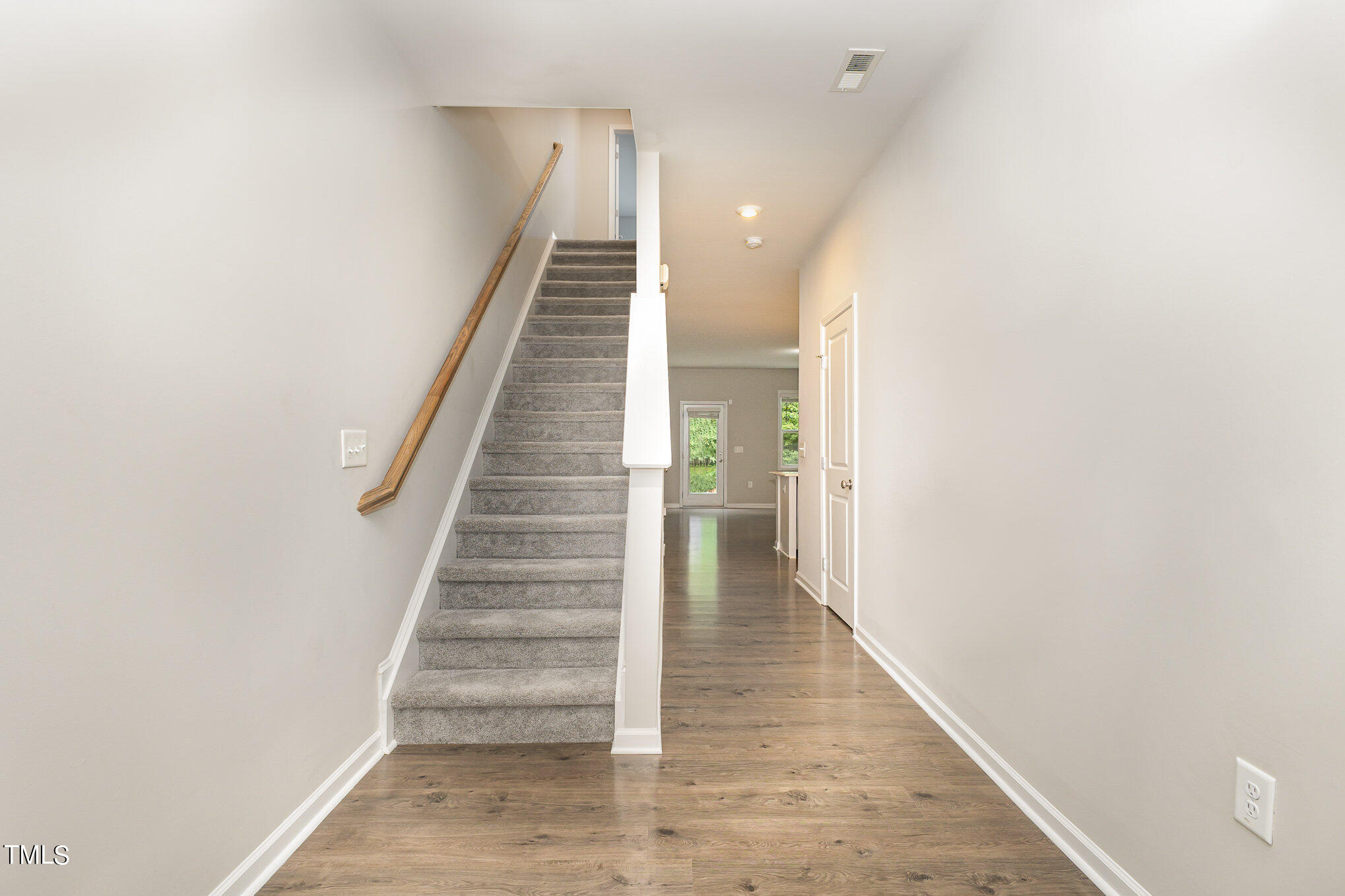 3607 Water Mist Lane Raleigh, NC 27604 - Photo 6 of 30 a view of entryway and hall with wooden floor
