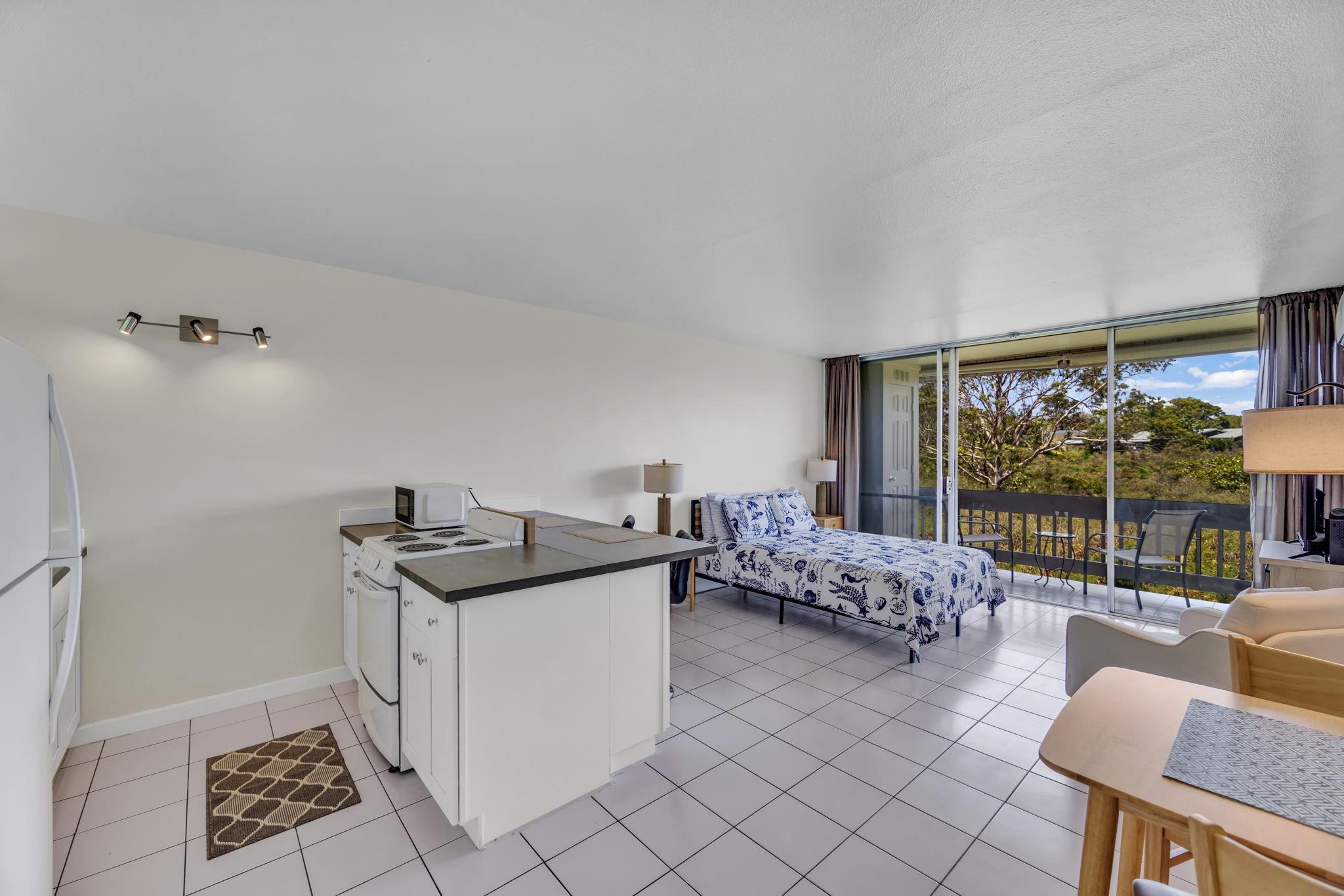 120 Hui Rd F, Unit E16 Lahaina, HI 96761 - Photo 1 of 24 a living room with furniture and a large window