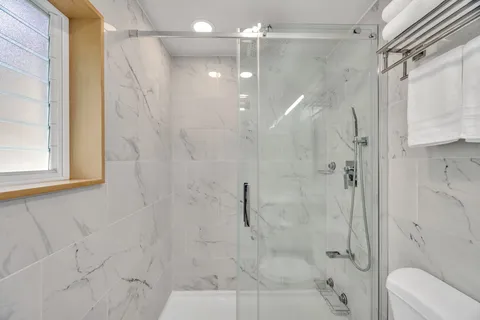 a view of swimming pool with chairs