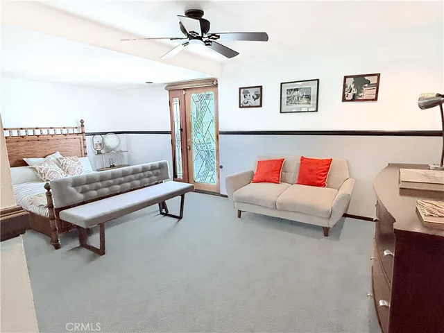 a living room with furniture and a night stand