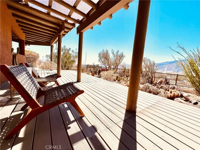 a view of a terrace with trees