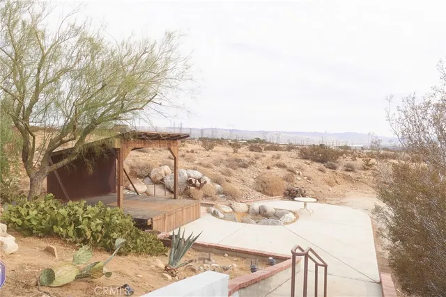 a view of a backyard of the house